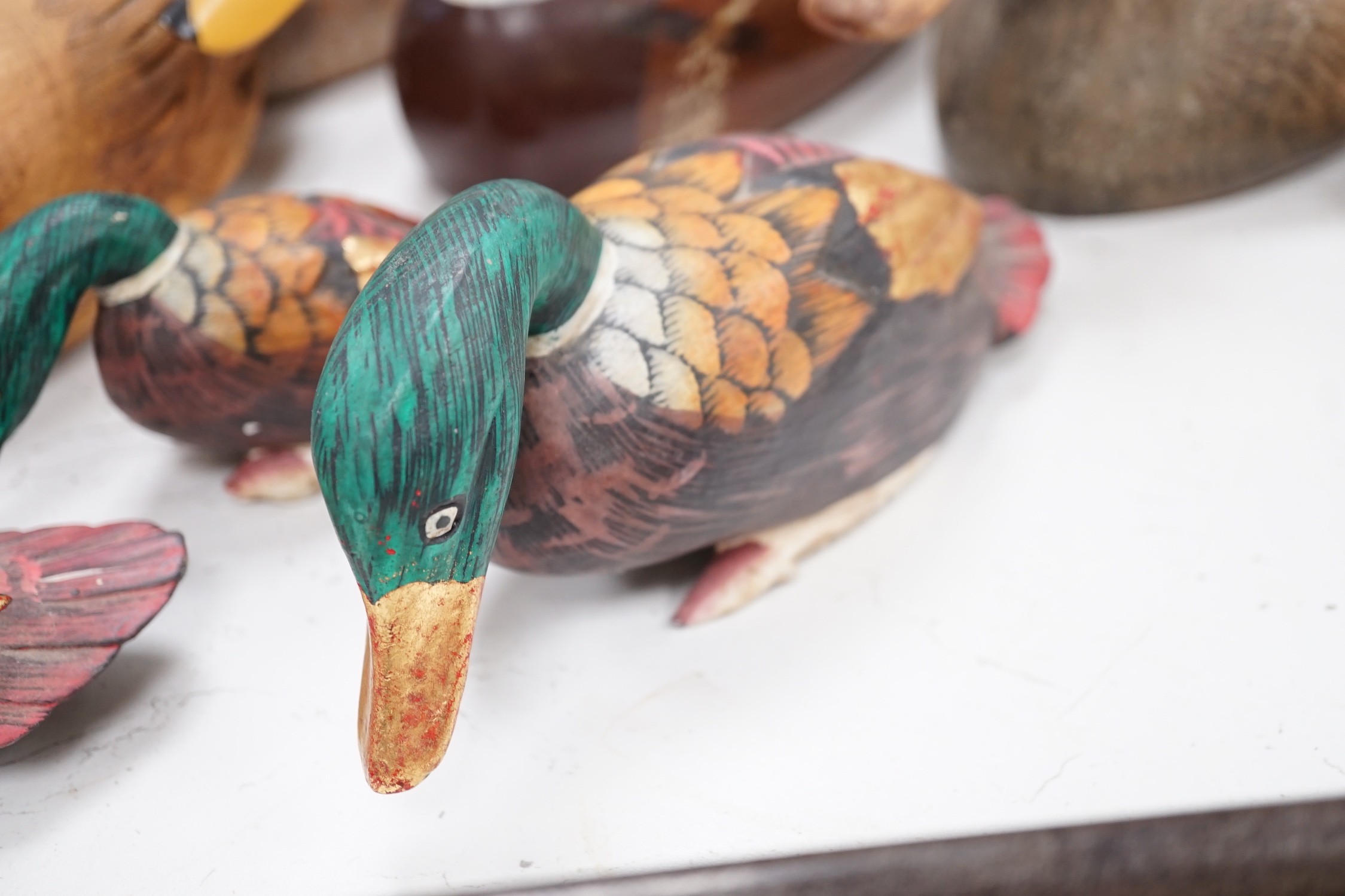 Nine carved wood decoy ducks